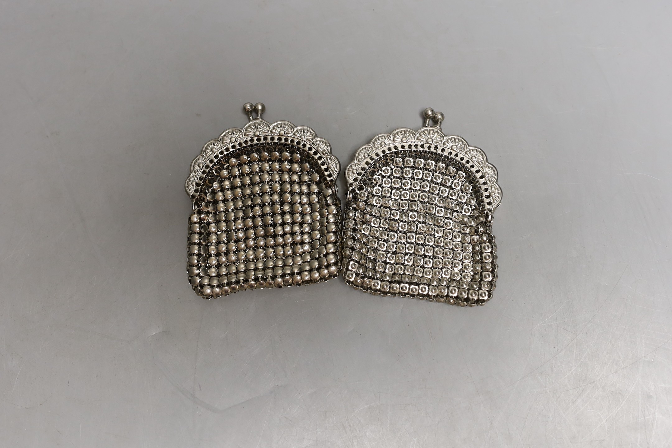 A chain mail metal evening bag and two similar purses.